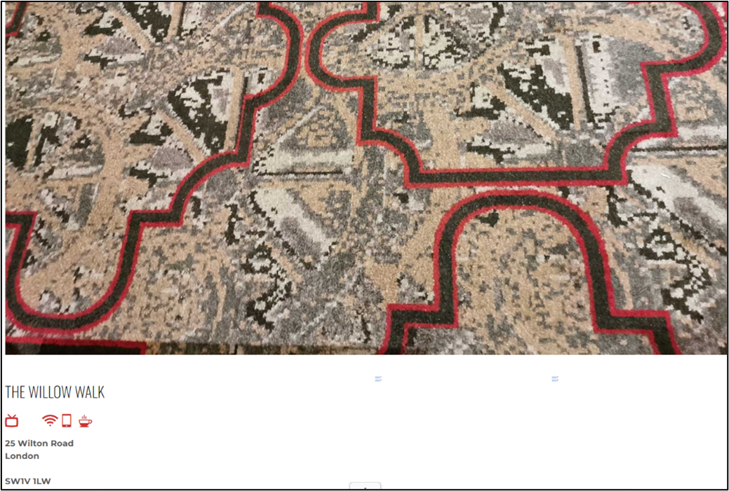 Close-up photograph of The Willow Walk’s distinctive patterned carpet with red borders and geometric designs.