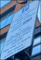 Close-up photo of a London parking sign showing operating hours, permit zone IS-A, RingGo payment number, and location code 61075.